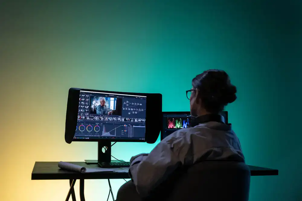 A technical 3D artist working on a dual-monitor setup